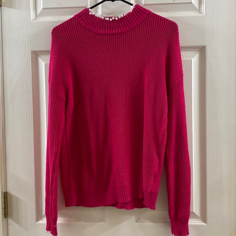 Women pink sweaters
